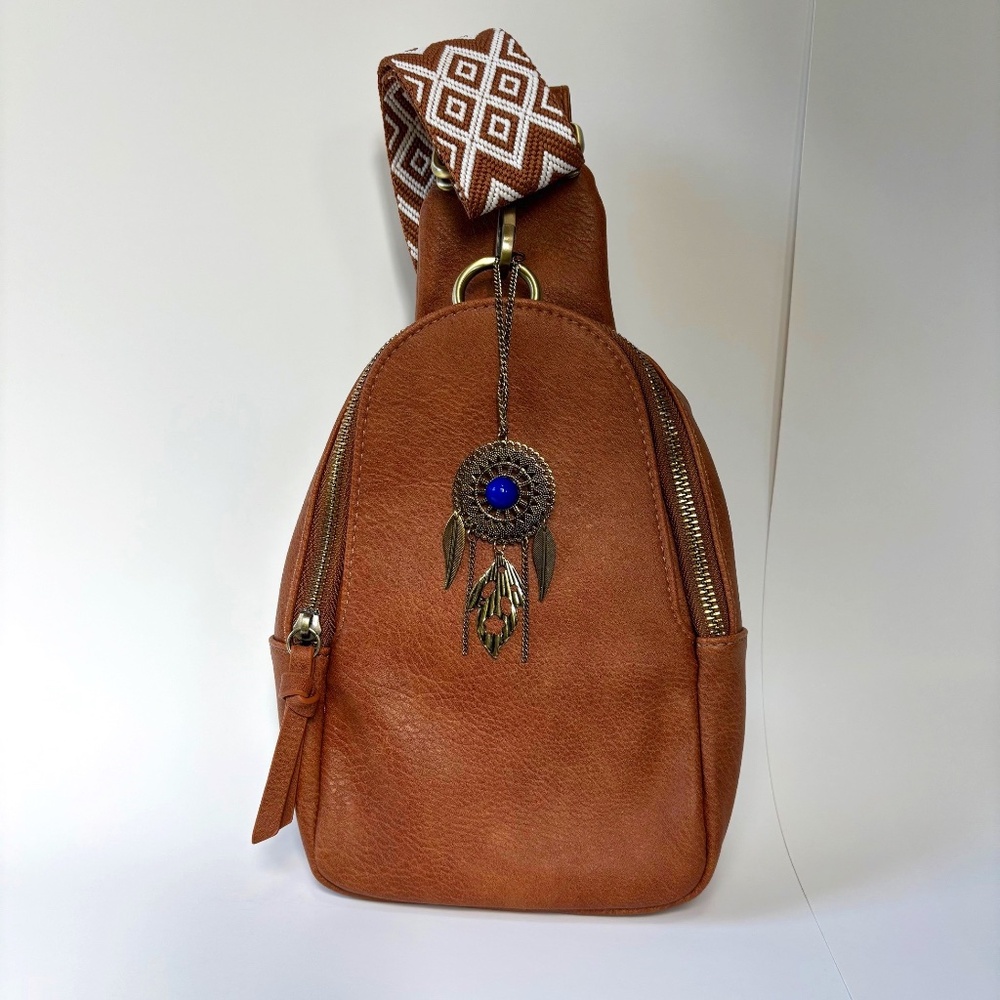 ANTHROPOLOGIE Urban Originals brown sling bag w/purse charm